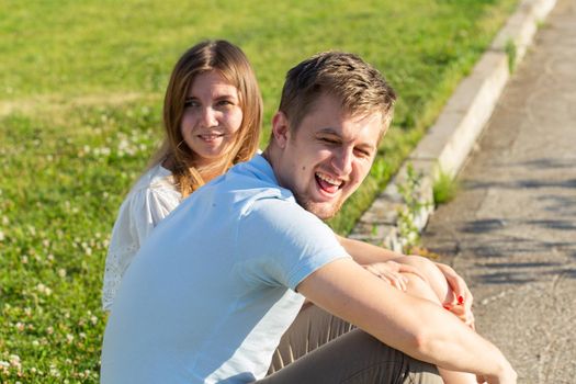 Young couple in love outdoor.Stunning sensual outdoor portrait of young stylish fashion couple posing in summer.