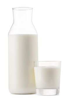 Glass bottle and cup of fresh milk isolated on white