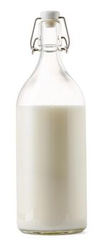 Closed glass milk bottle isolated on white background close up