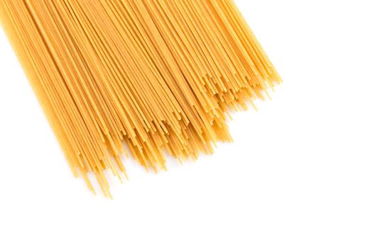 Organic whole wheat spaghetti pasta on white background