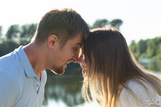 happy romantic couple in love and having fun outdoor in summer day, beauty of nature, harmony concept.