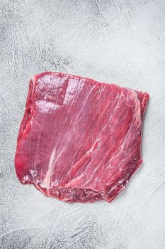 Raw flank or flap beef meat steak. White background. Top view.