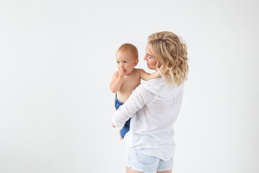 Childhood, motherhood and family concept - Portrait happy mother holds her baby.