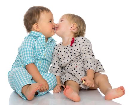 Toddler boy and girl, cute hugging in studio on a white background. The concept of a harmonious development of a child in the family, a happy childhood. Isolated.