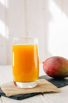 Mango juice in the glass, fresh fruit drink