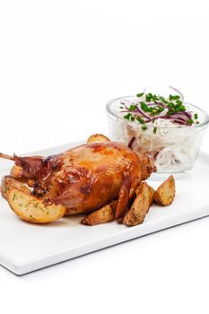 Roasted chicken with crust isolated on white background close up