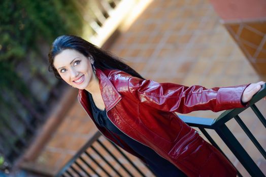 Portrait of beautiful woman with long hair in urban background