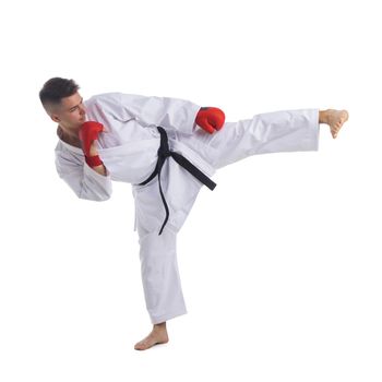 Black Belt TaeKwonDo Karate athlete man show traditional Fighting pose high leg kick in sport uniform white background isolated full length profile
