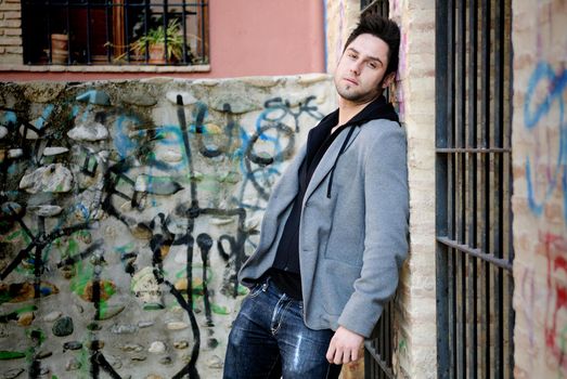 Portrait of handsome man in urban background