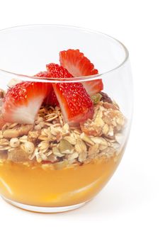 Granola with jam and strawberries isolated on white background