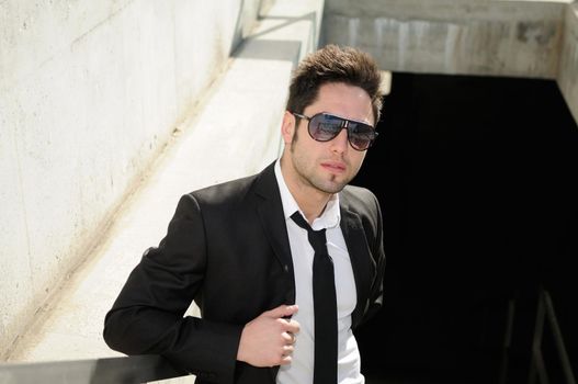 Portrait of a handsome young businessman with sunglasses