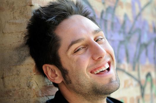 Portrait of happy man in urban background
