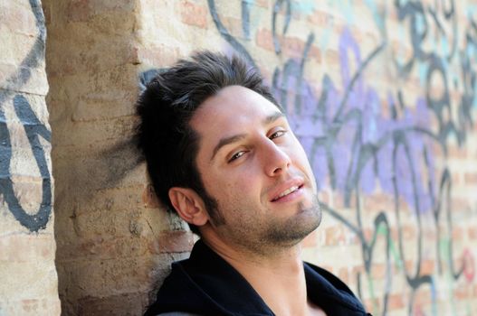 Portrait of happy man in urban background