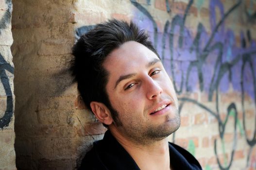 Portrait of happy man in urban background