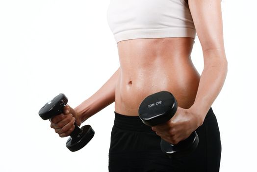 Portrait of young woman lifting weights