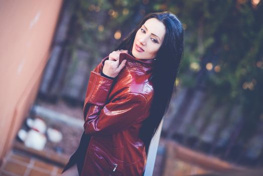 Portrait of beautiful woman with long hair in urban background