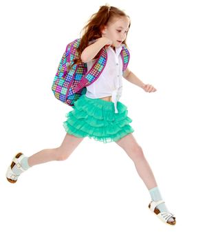 Joyful little girl with long hair to the waist which wire braided white ribbons. In a white shirt without a pattern and green short skirt. Girl jumping over obstacles big step - Isolated