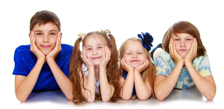 Horizontally elongated rectangular frame. Two little girls sisters and two brothers of a teenager lying on the floor with his head in his hands. The picture shows 4 children - Isolated on white background