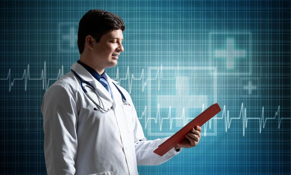 Doctor with a tablet, holds in his hands and looks at medical documents