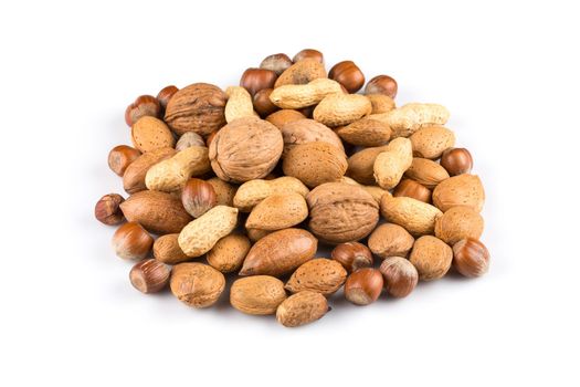 Mixed nuts in shells on a white background