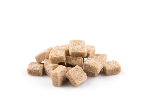 brown sugar cubes isolated on a white background