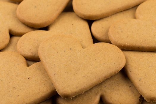 Gingerbread hearts cookies as a background. Christmas decoration.