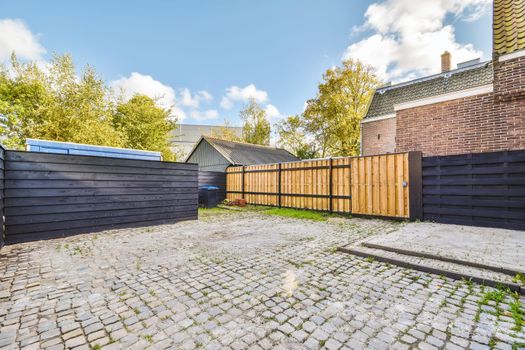 Delightful backyard of the brick house with big windows