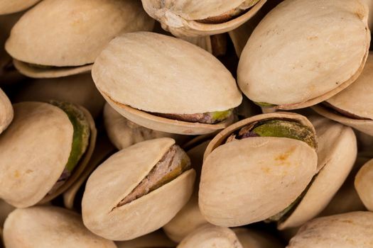 Pistachio nuts arranges as background close up