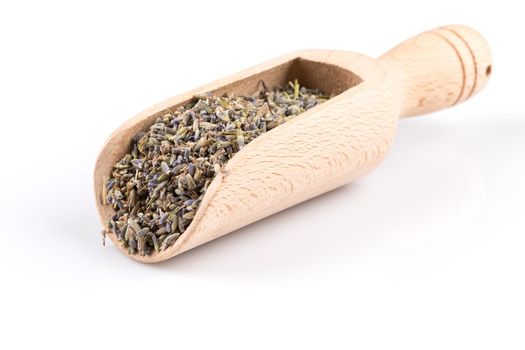 dried lavender organic tea in wooden scoop Isolated on white background