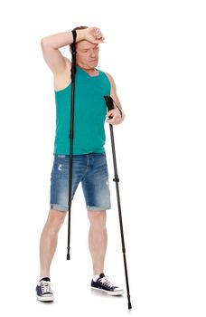 Man in t-shirt and shorts, Nordic walking sticks, hand wipes his sweat from his forehead -Isolated on white background