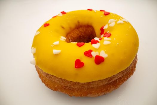 junk food concept - Big donut with yellow glaze