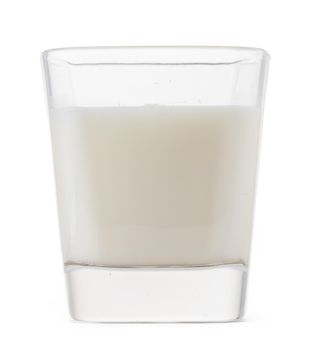 Glass of milk isolated on white background close up