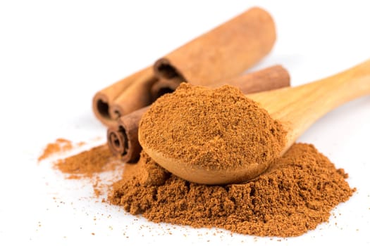 cinnamon ground and sticks isolated on a white background