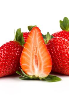 Red ripe strawberry fruits on a dark background