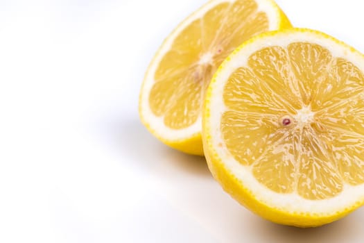 Two organic natural lemon slices on a white background