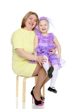 Young blonde mother, gently hugs her favorite little round-faced daughter. Family Idyll.Isolated on white background.