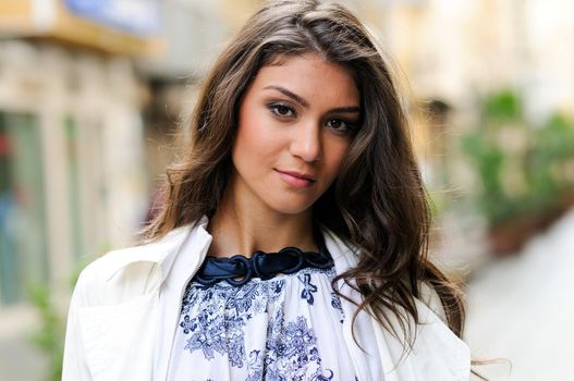 Portrait of a beautiful woman in urban background