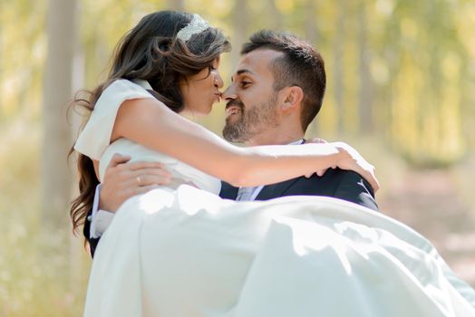 Just married couple together in poplar background