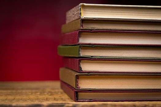 Books on wooden table close up photo