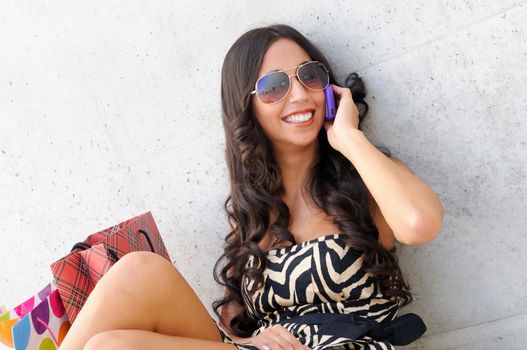 Young beautiful woman talking on phone
