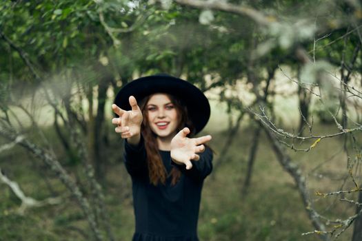 witch in the woods posing costume halloween gothic style. High quality photo