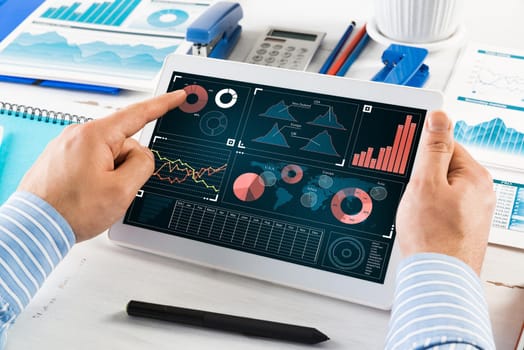 close-up, male hands with tablet. Businessman working at the table in office