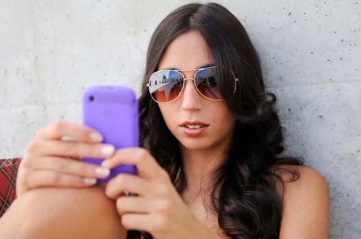 Young beautiful woman talking on phone