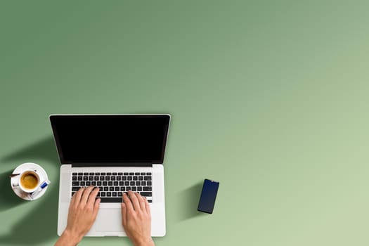 Man working with laptop, top view.