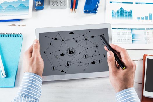 Men's hands hold a computer tablet. Social media concept