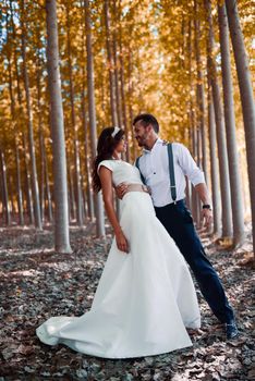 Just married couple together in poplar background