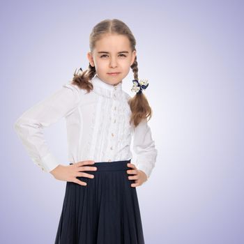 A beautiful little schoolgirl girl in a white blouse and black long skirt, with neatly braided pigtails on her head.She is posing in front of the camera, her hands on her hips.Purple gradient background.