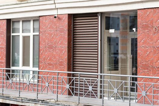 Window with modern shutter, exterior shot.