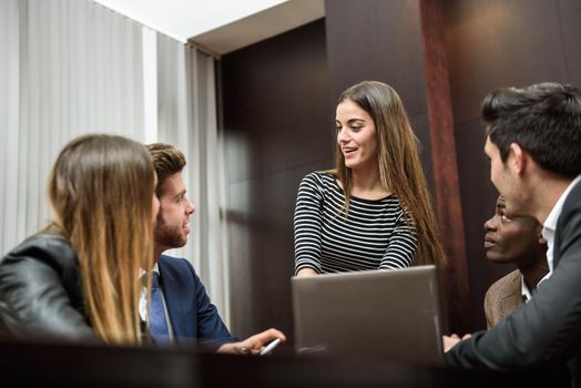 Businesspeople, teamwork. Group of multiethnic busy people working in an office