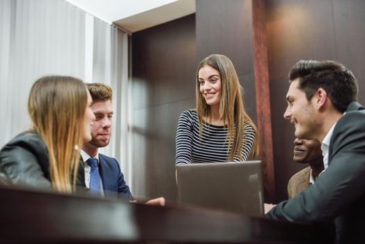 Businesspeople, teamwork. Group of multiethnic busy people working in an office